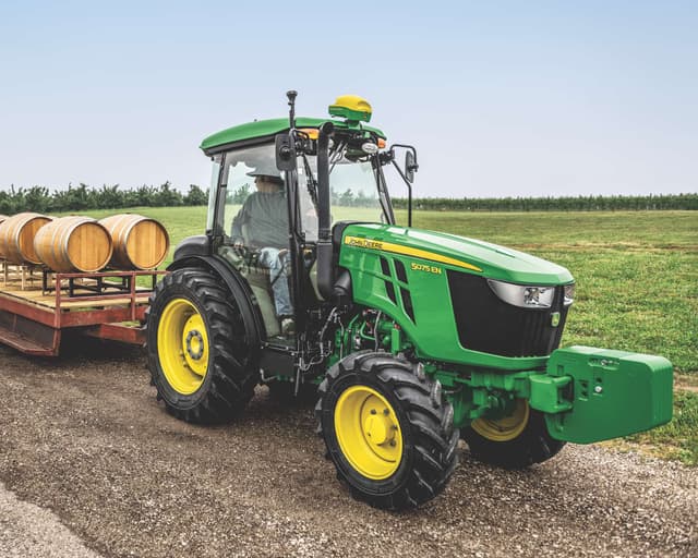 5075 Tractor John Deere tractor hauling wooden barrels