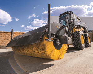 Skid Steer working on pavement